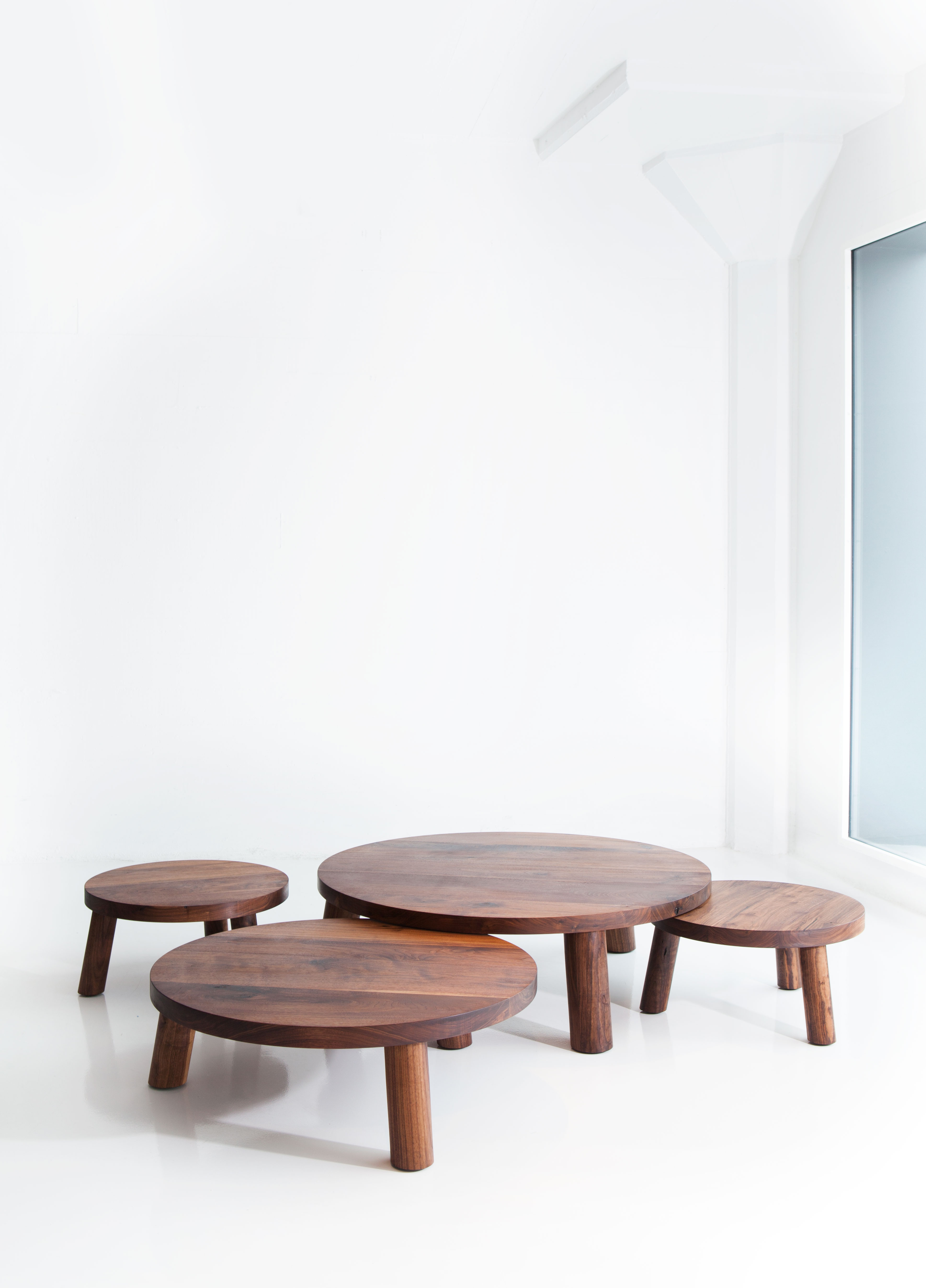A group of round wooden tables
